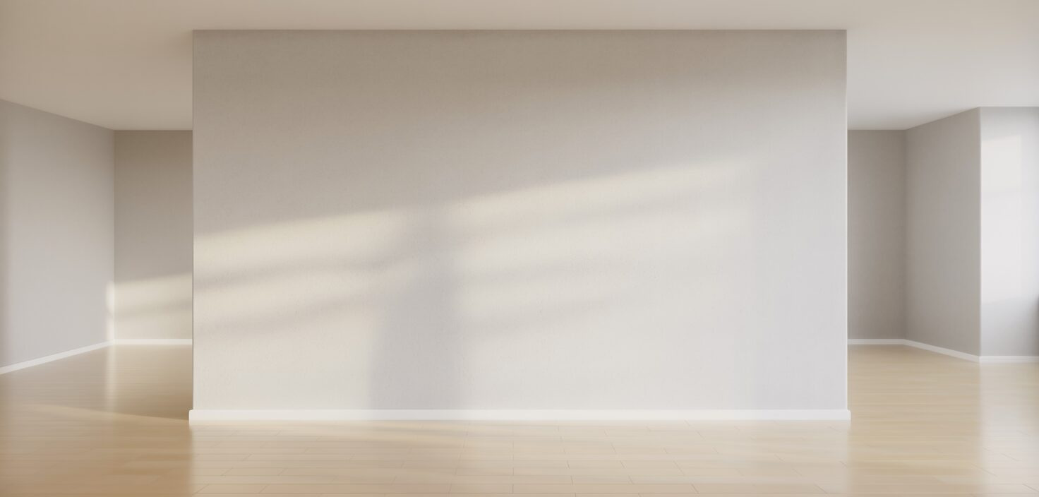 Invändig målning av ett rum, med ljusa väggar och minimalistisk inredning.