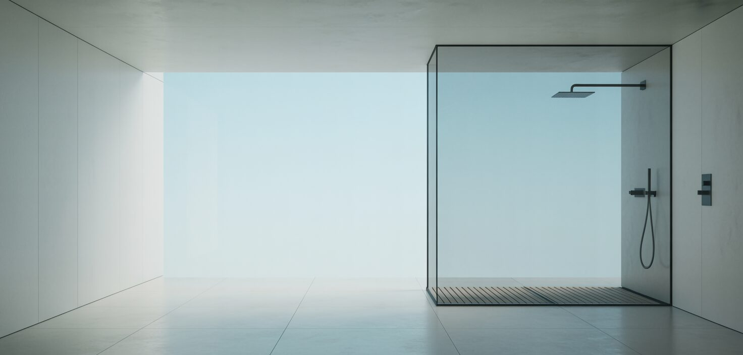 Ett minimalistiskt badrum med vita väggar, en takdusch och elegant design.